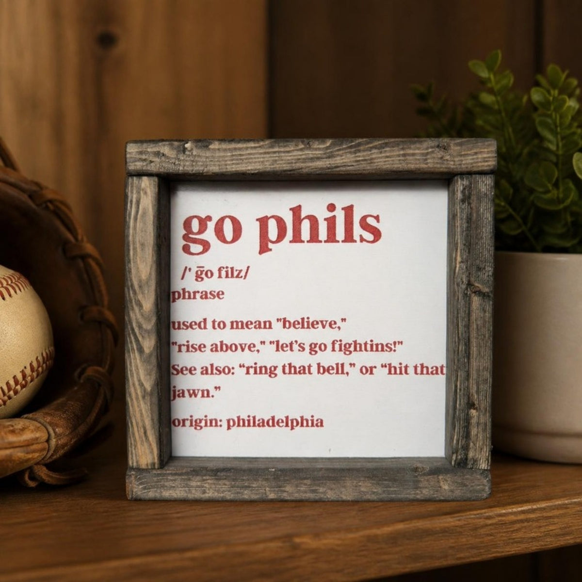Go Phils framed sign on a shelf
