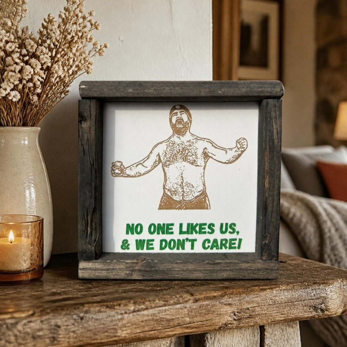 No one likes us and we don't care framed sign on a mantel