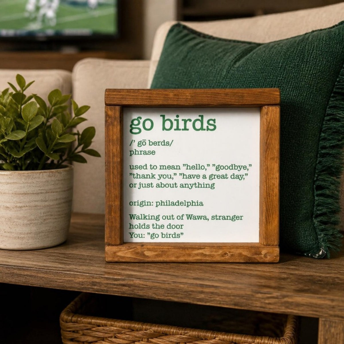 Go Birds framed sign in a living room