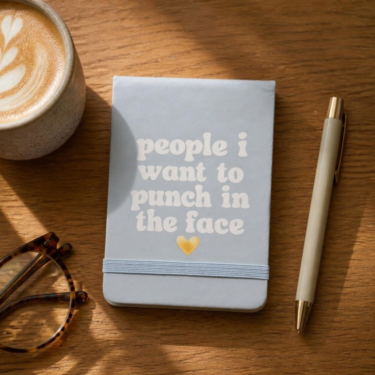 People I want to punch in the face notepad on a desk