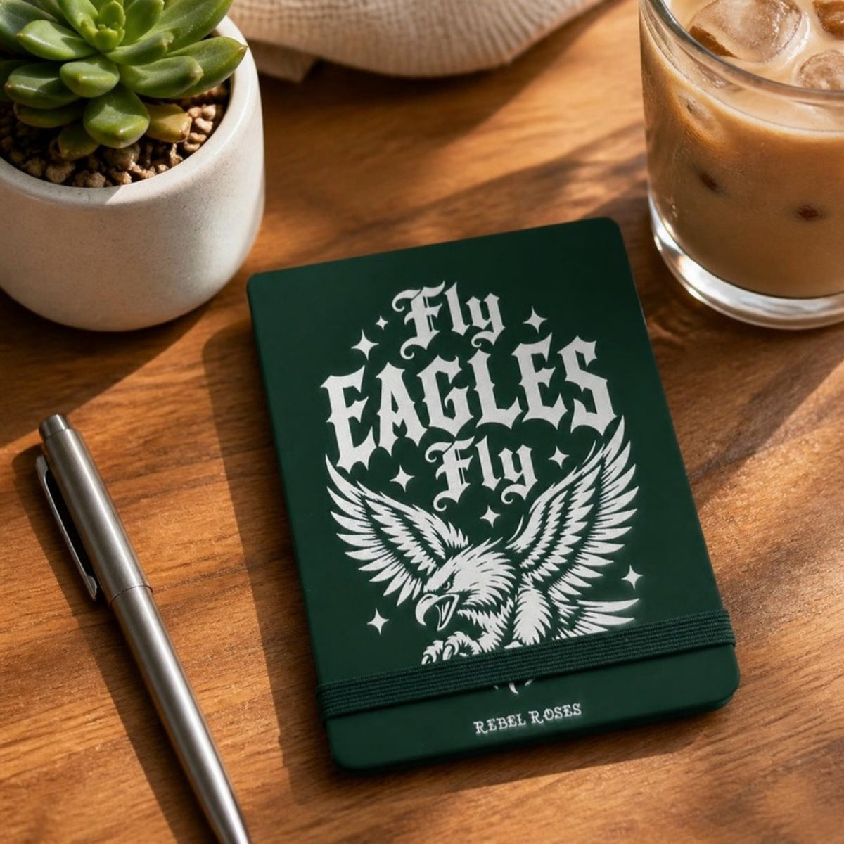 Fly Eagles Fly notepad on a desk