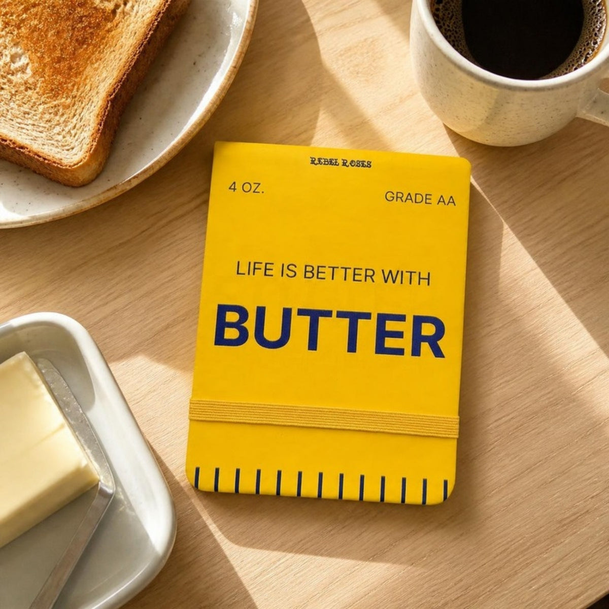 Life is better with butter notepad on a breakfast table